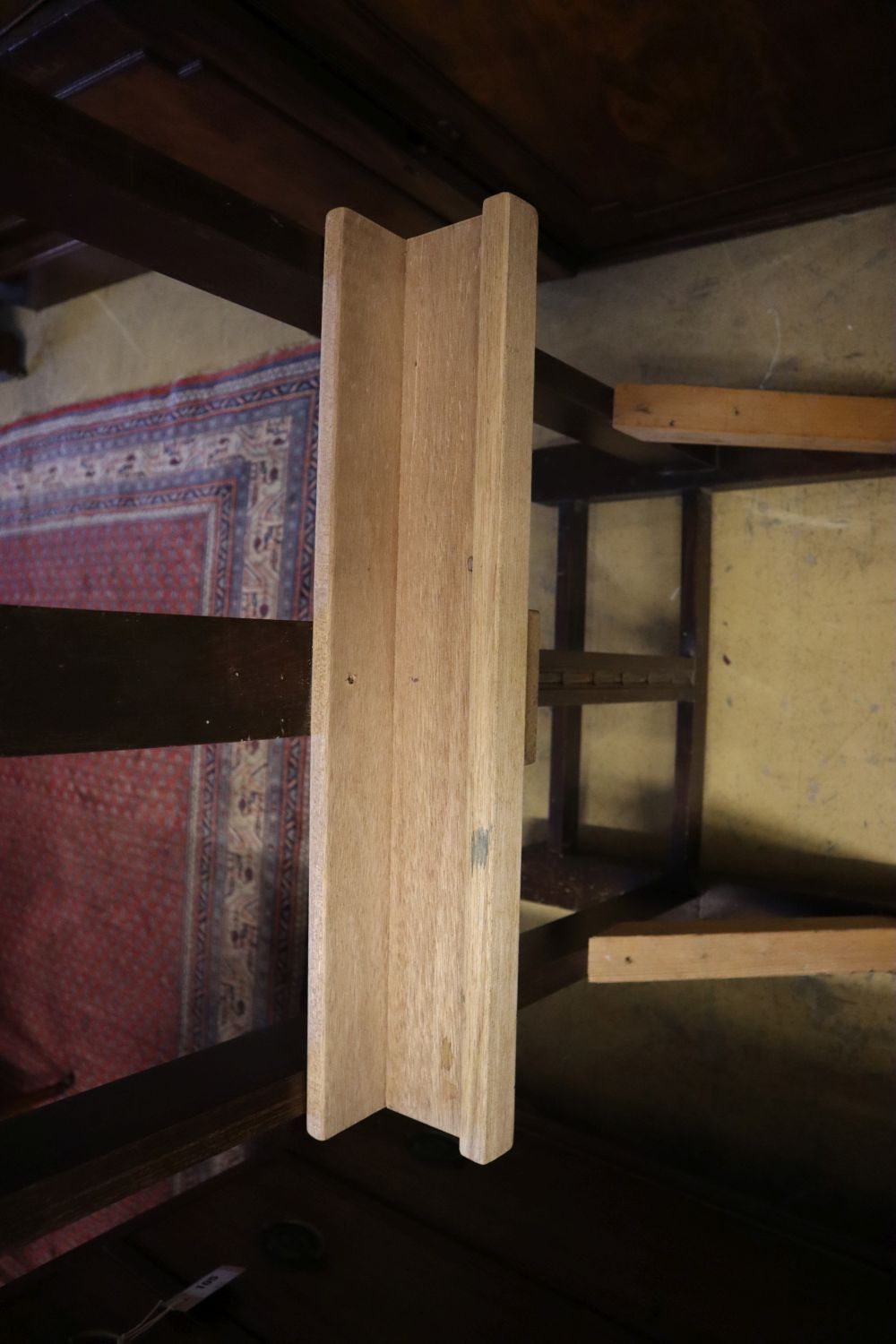 An early 19th century oak studio artists easel, width 55cm (incorporates later timber)